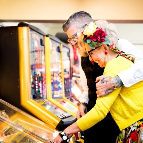 couple playing arcade games party themed couple playing arcade games party themed